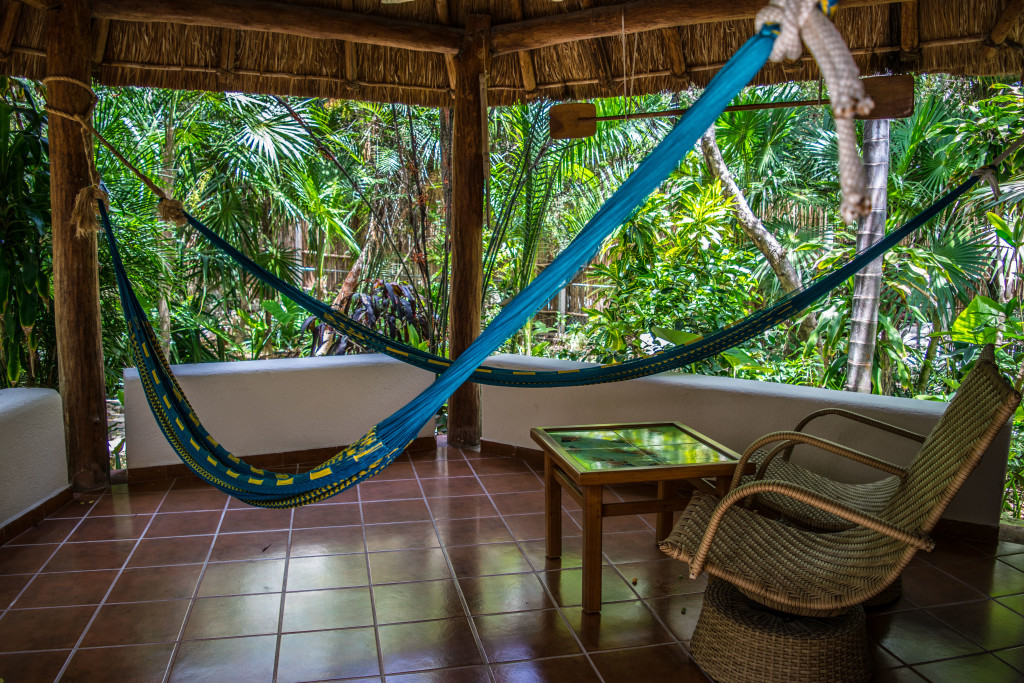 hammock and chairs on bungalow porch