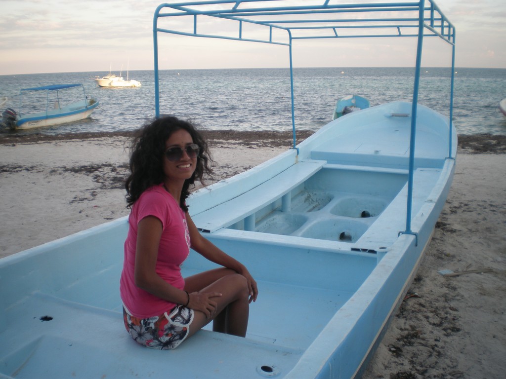 Cris sitting in a boat 