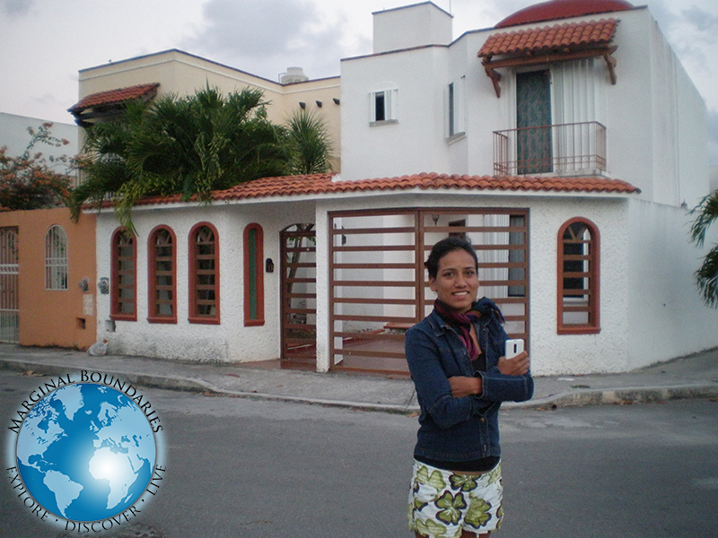 Cris in front of neighbor's home